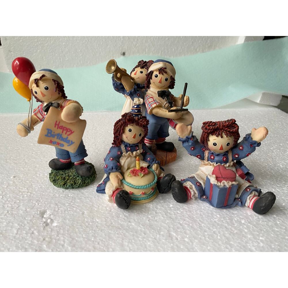 vintage Raggedy Ann and Andy resin figurines produced by Enesco. 4 figures